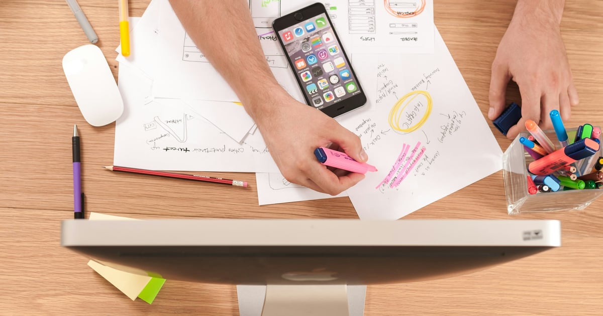 Papers, Phone, and Monitor